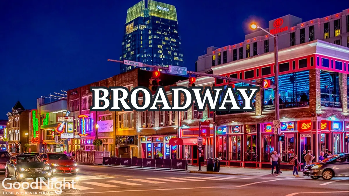 A bustling Nashville street scene at night, alive with neon signs, illuminated buildings, and crowds of people engaging in nightlife, dining, and entertainment. The energy and excitement of the city’s legendary music venues and vibrant urban life are palpable.